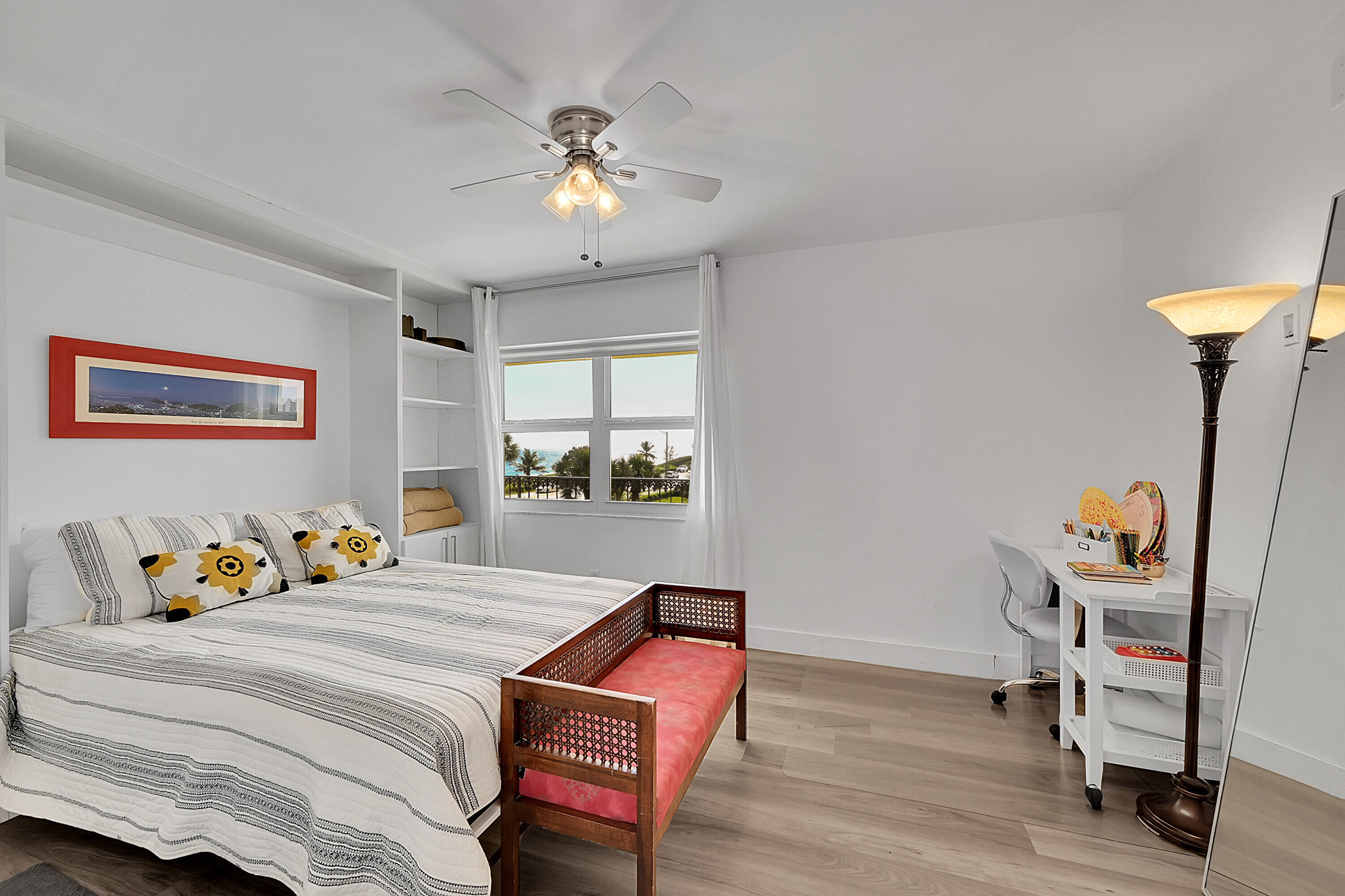 2871 North Ocean Boulevard, Unit D302 Boca Raton, FL 33431 - Photo 28 of 59 a bedroom with a bed and wooden floor