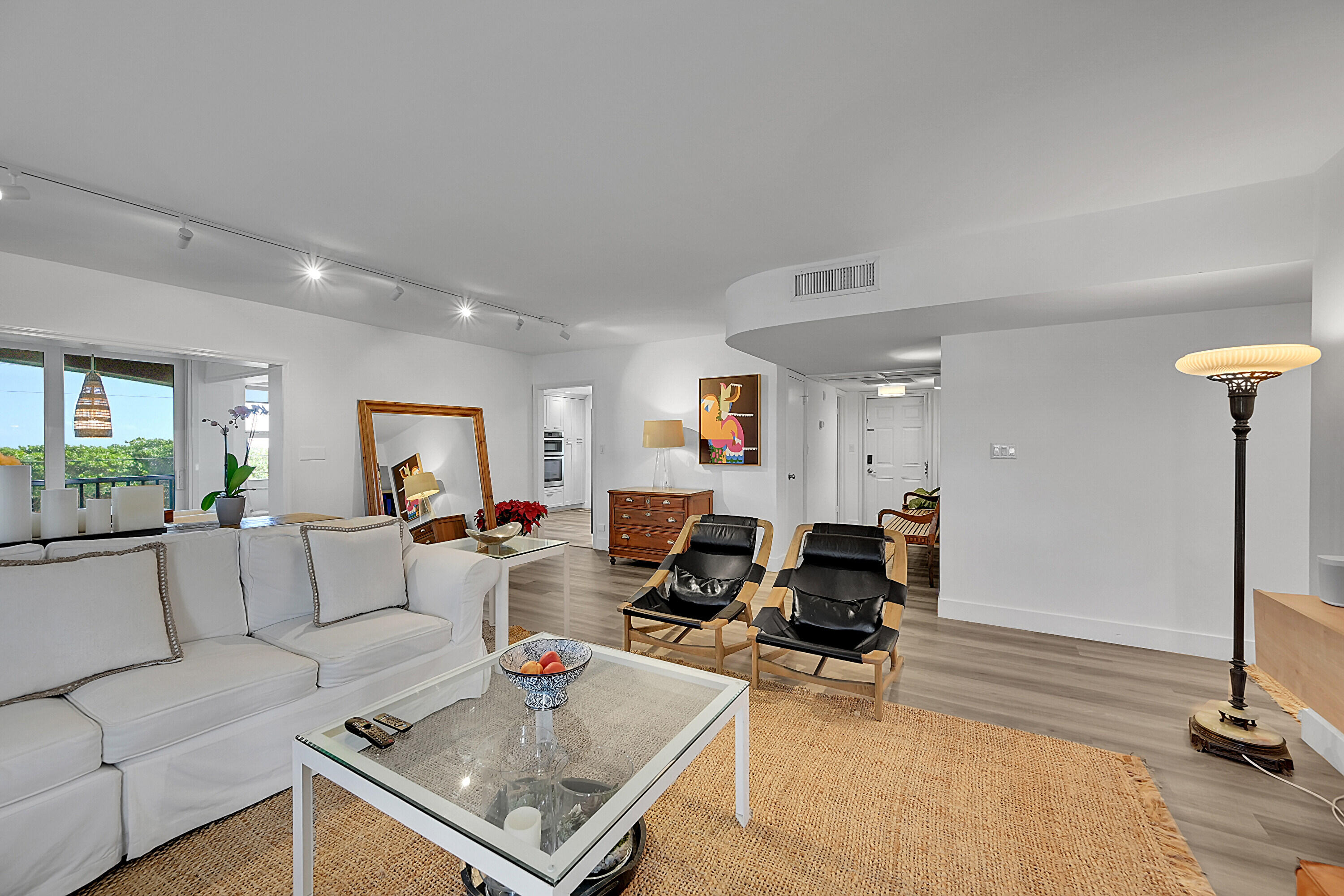 2871 North Ocean Boulevard, Unit D302 Boca Raton, FL 33431 - Photo 7 of 59 a living room with furniture and a table