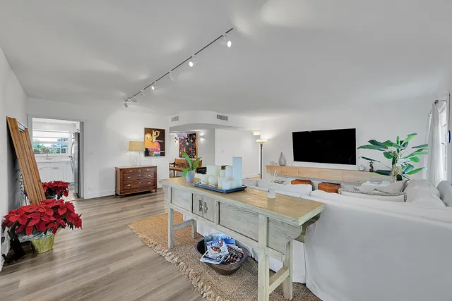 a bathroom with a double vanity sink toilet mirror and shower