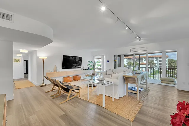 a view of a street with a building in the background