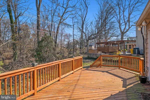 a view of balcony with wooden floor and fence