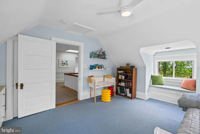 a view of a livingroom with furniture and a flat screen tv