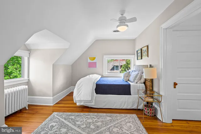a bedroom with furniture and a rug