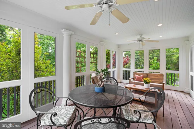a living room with furniture and a dining table