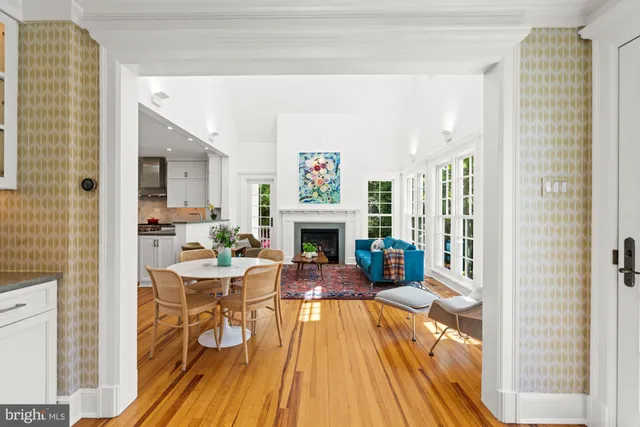 a view of a livingroom with furniture wooden floor and windows