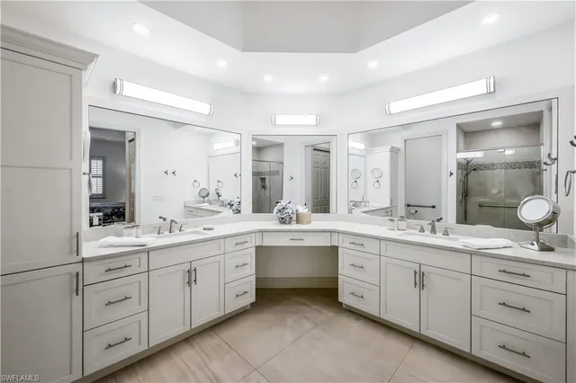 a large bathroom with a double vanity sink and mirror