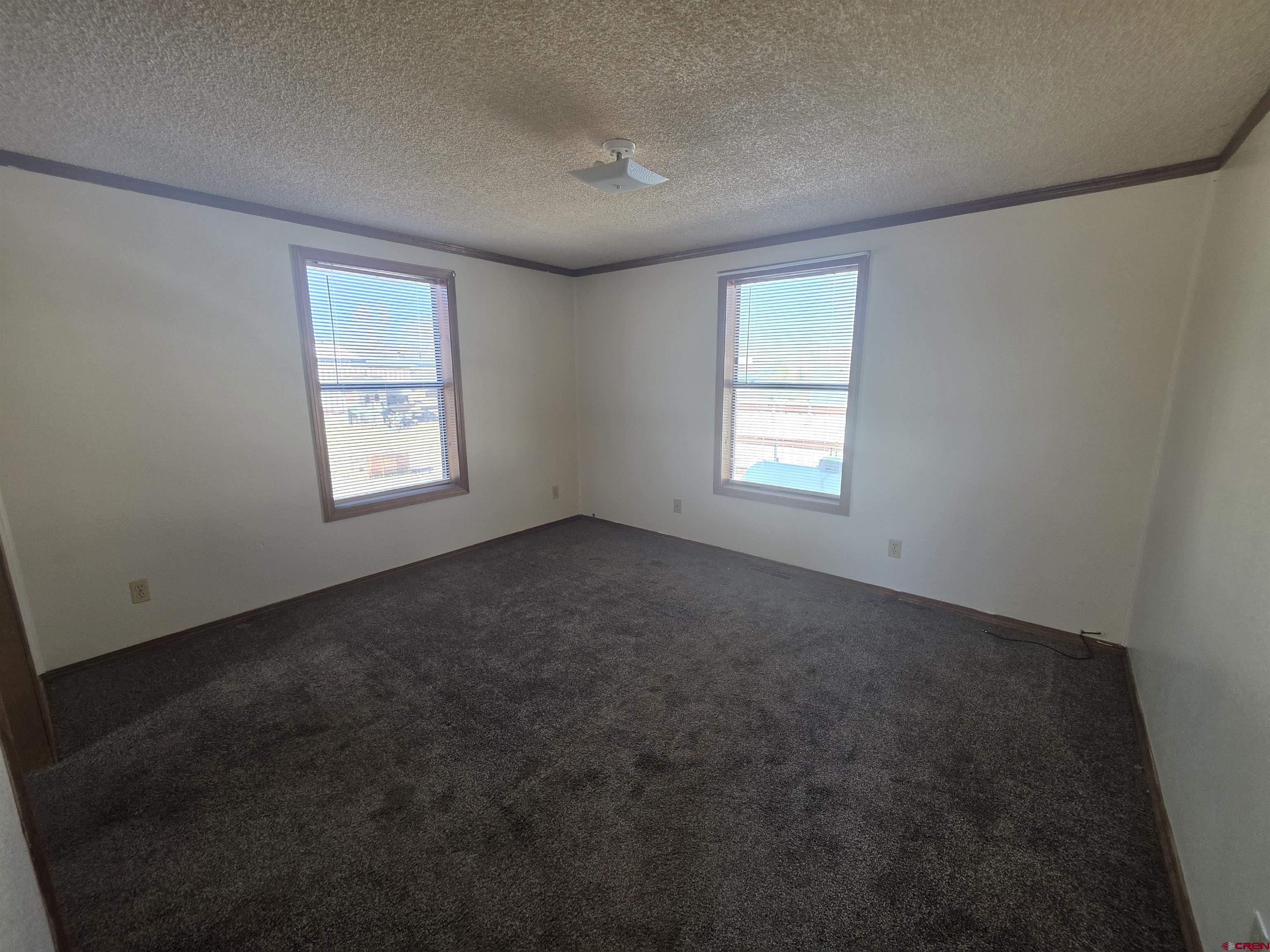 232D Arapahoe Road South Fork, CO 81154 - Photo 11 of 23 a view of empty room with windows
