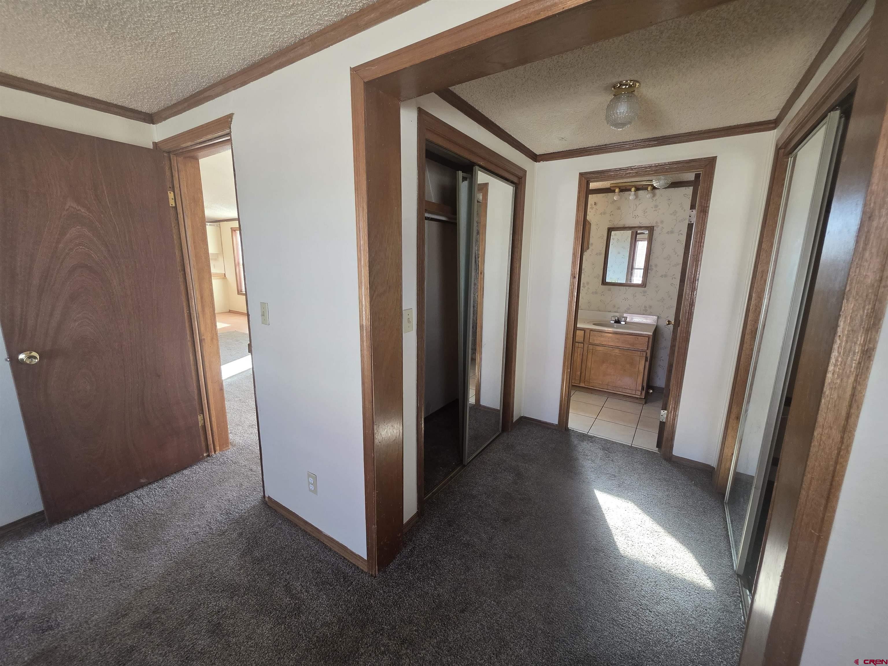 232D Arapahoe Road South Fork, CO 81154 - Photo 12 of 23 a view of hallway with window and wooden floor
