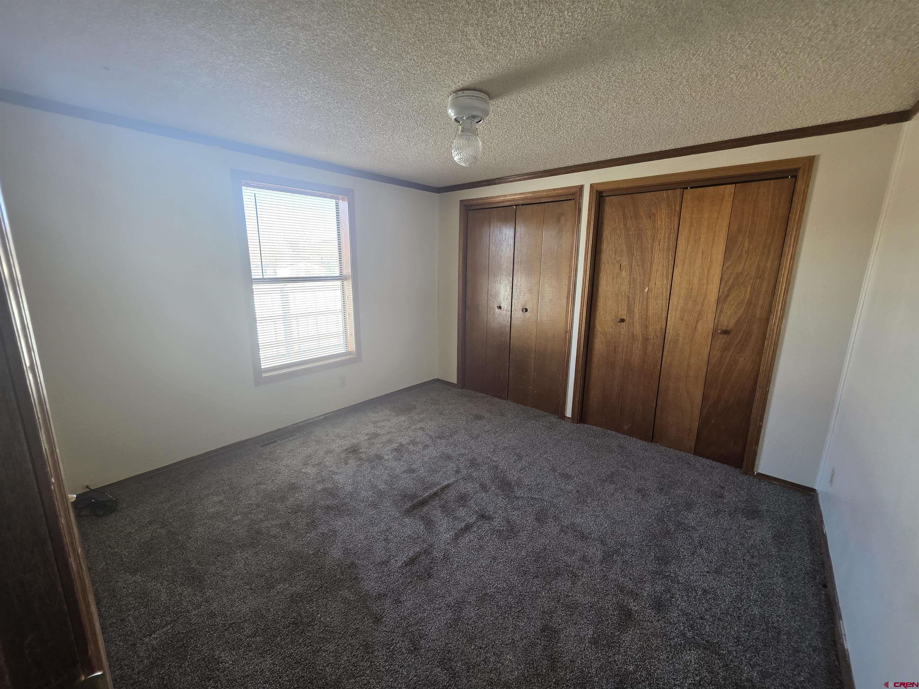 232D Arapahoe Road South Fork, CO 81154 - Photo 15 of 23 an empty room with windows