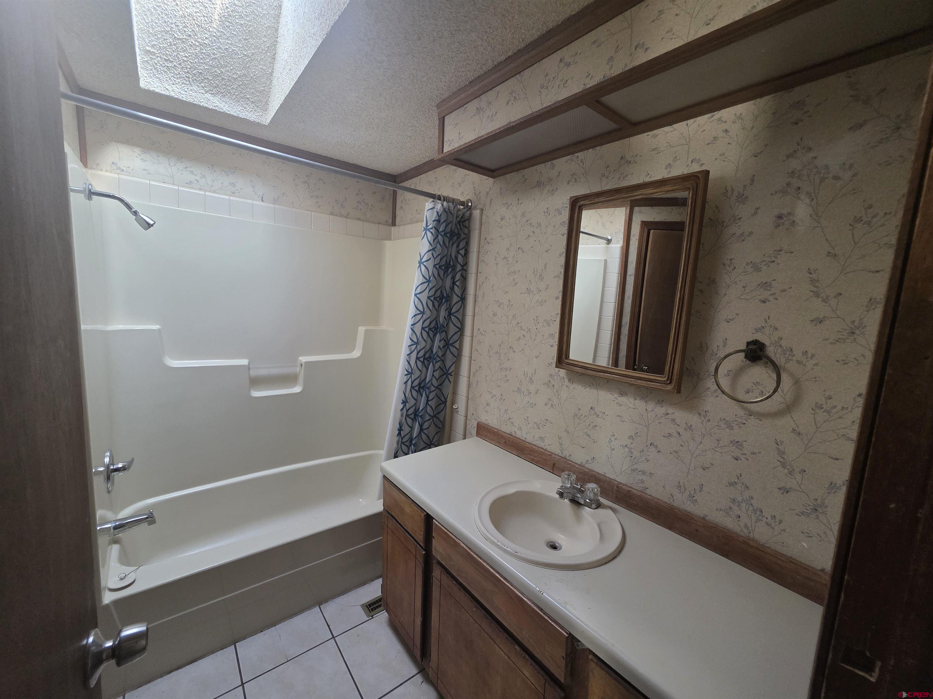 232D Arapahoe Road South Fork, CO 81154 - Photo 17 of 23 a bathroom with a sink a toilet and shower
