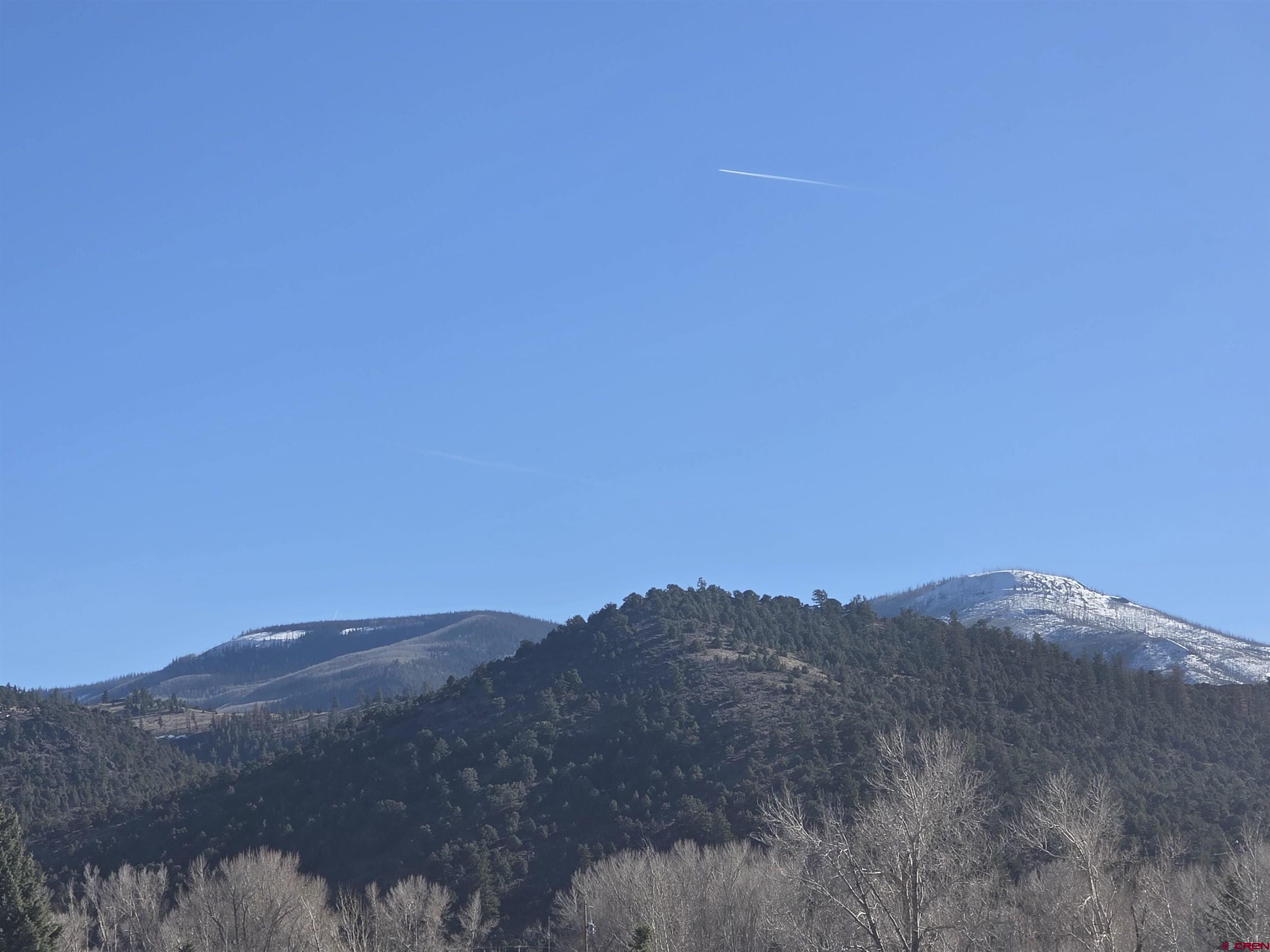232D Arapahoe Road South Fork, CO 81154 - Photo 22 of 23 a view of a large building with mountains in the background