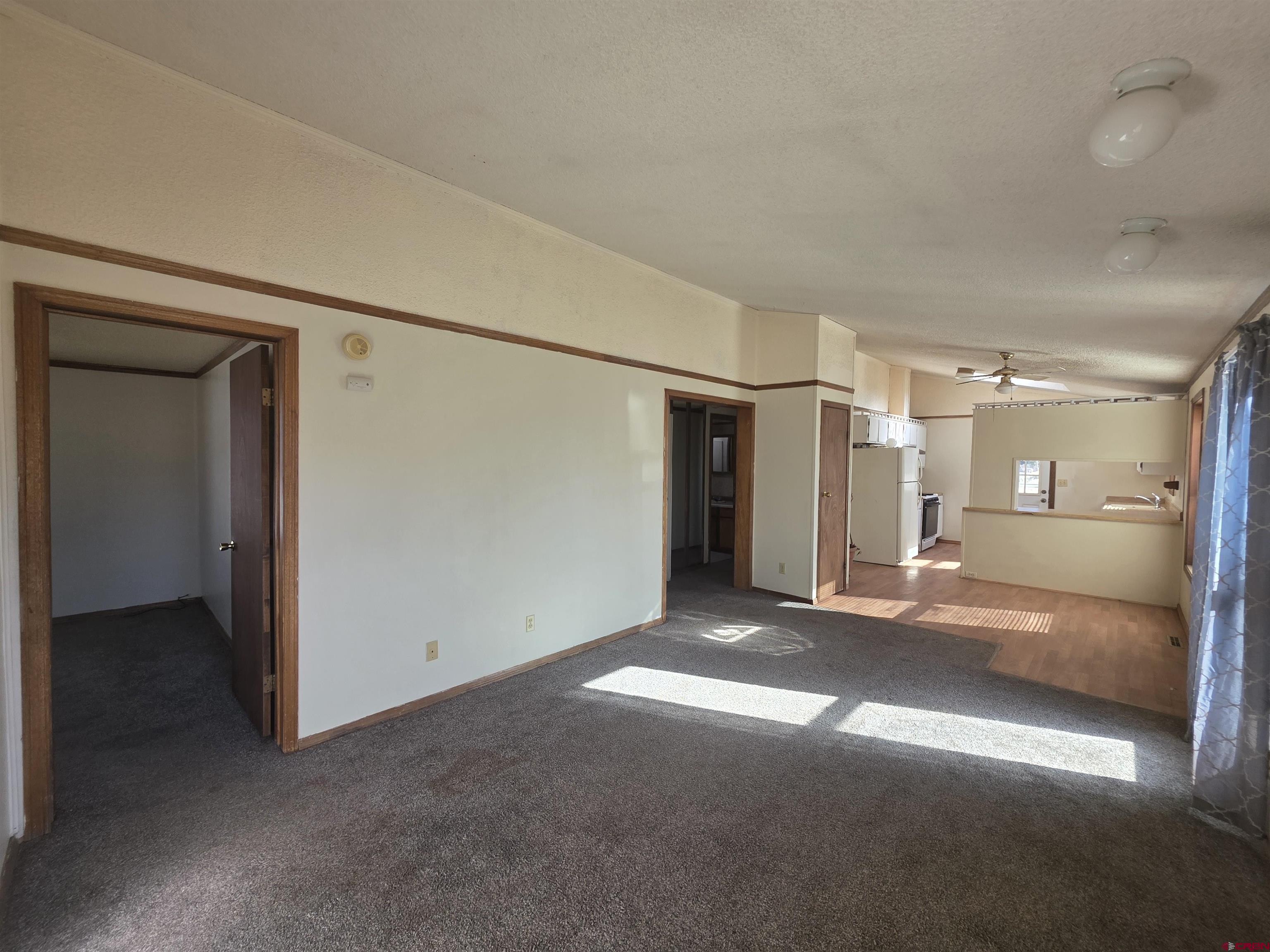 232D Arapahoe Road South Fork, CO 81154 - Photo 7 of 23 a view of empty room with wooden floor