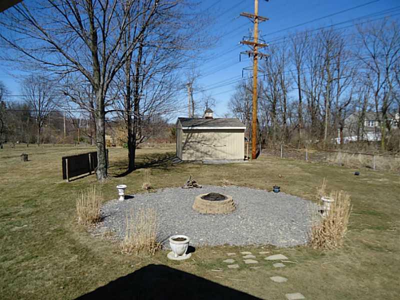 1217 Kings Mill Road Aliquippa, PA 15001 - Photo 21 of 24 Yard/Garden. Enjoy and relax around the backyard fire pit.