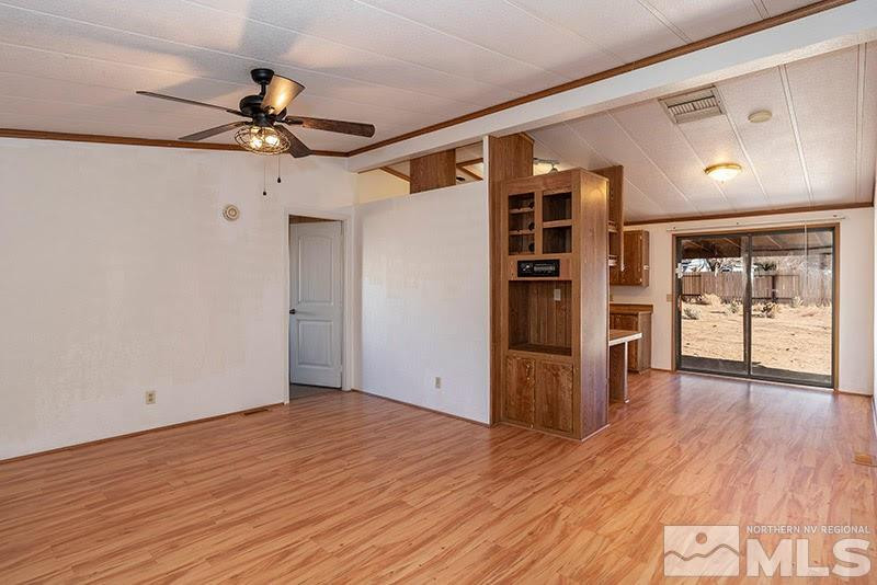 3862 Puffin Street Reno, NV 89508 - Photo 3 of 19 a view of empty room with wooden floor and fan