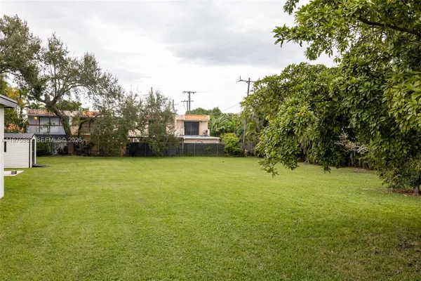 a kitchen with stainless steel appliances granite countertop a refrigerator and a stove