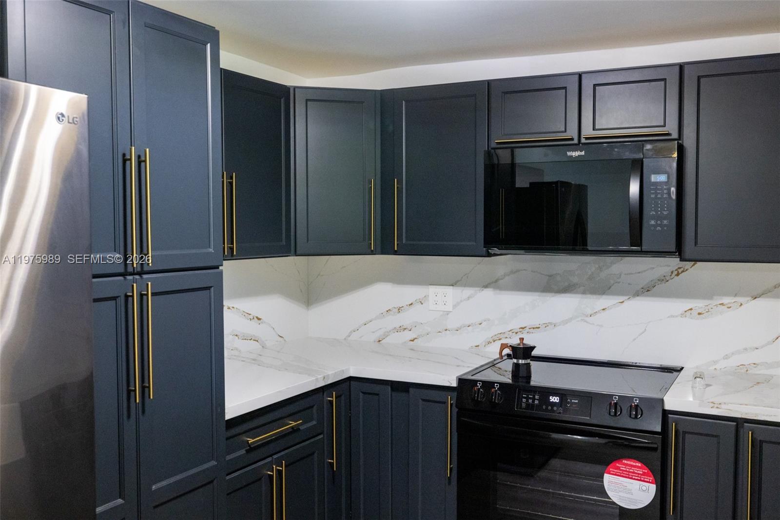 3401 Southwest 17th Street, Unit 3401 Miami, FL 33145 - Photo 19 of 69 a bathroom with a sink and a mirror