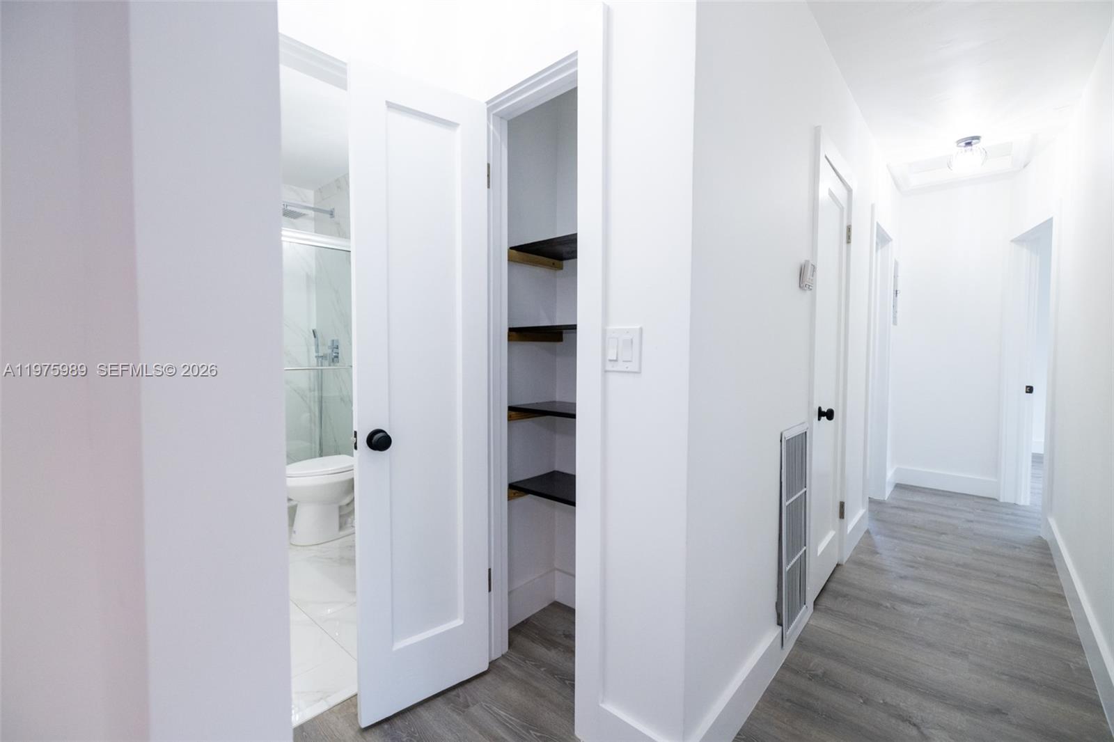 3401 Southwest 17th Street, Unit 3401 Miami, FL 33145 - Photo 27 of 69 a view of a bathroom from a hallway