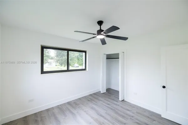 a bathroom with a shower and a toilet