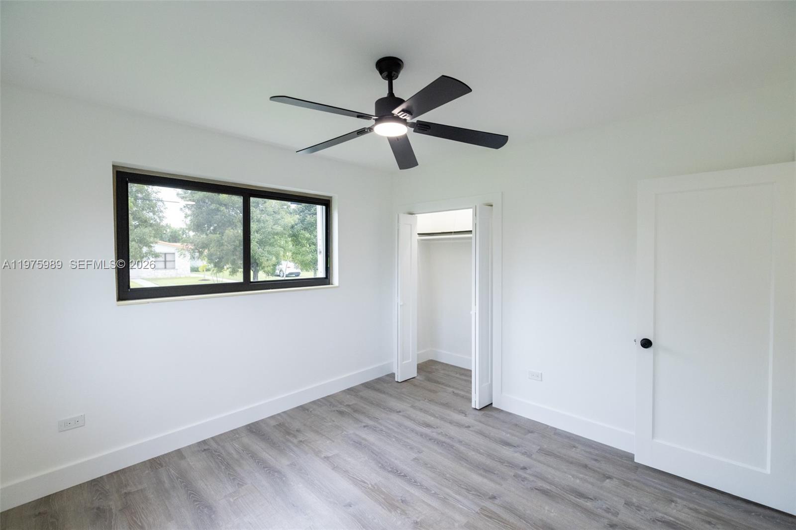 3401 Southwest 17th Street, Unit 3401 Miami, FL 33145 - Photo 32 of 69 a view of empty room with wooden floor and fan