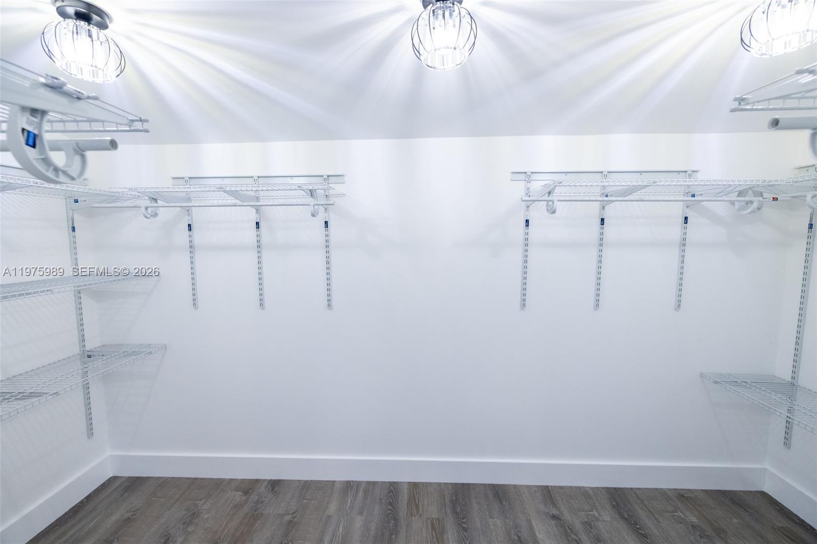 3401 Southwest 17th Street, Unit 3401 Miami, FL 33145 - Photo 48 of 69 a view of walk in closet with empty racks