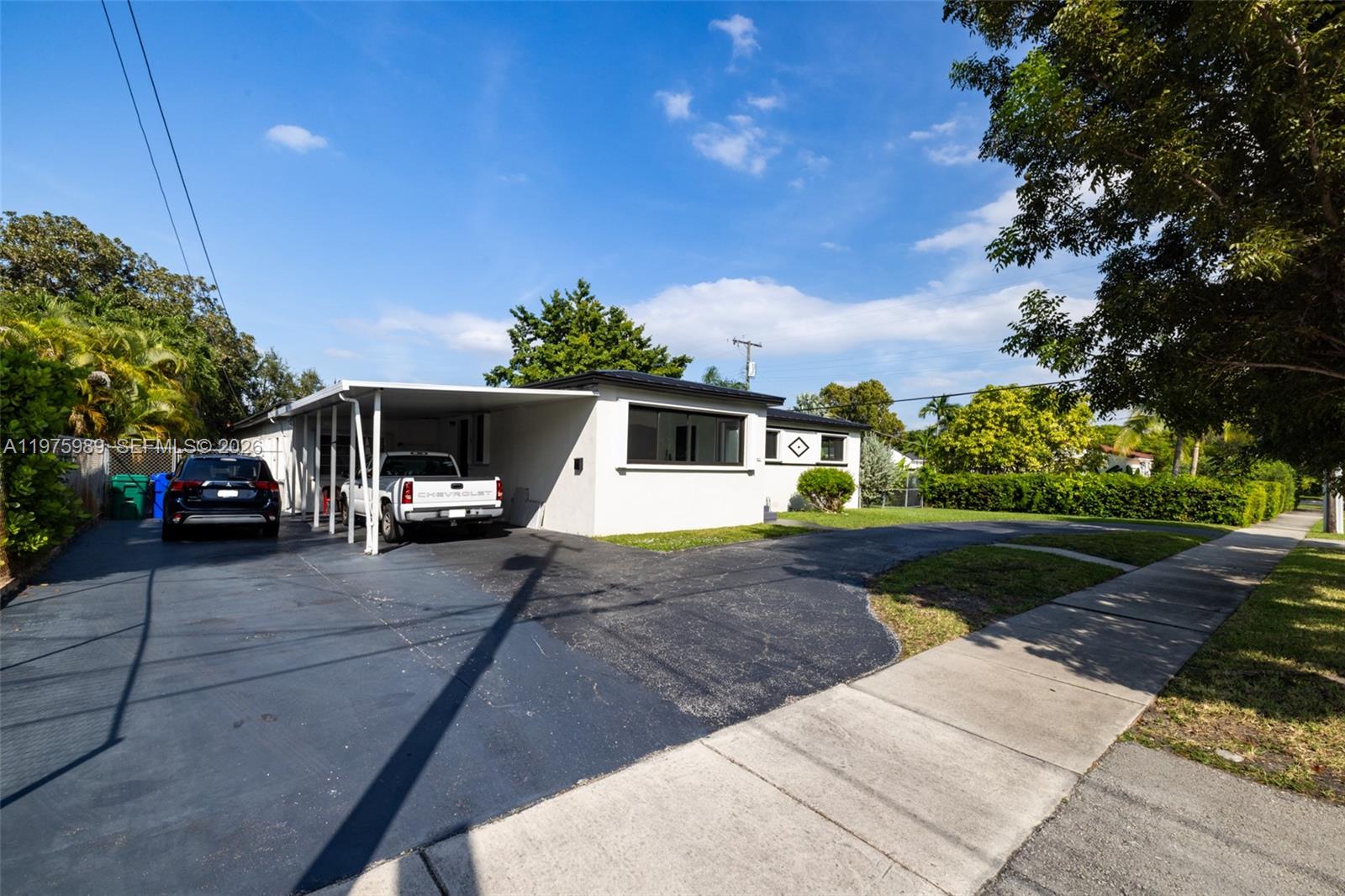 3401 Southwest 17th Street, Unit 3401 Miami, FL 33145 - Photo 6 of 69 a front view of a house with a yard