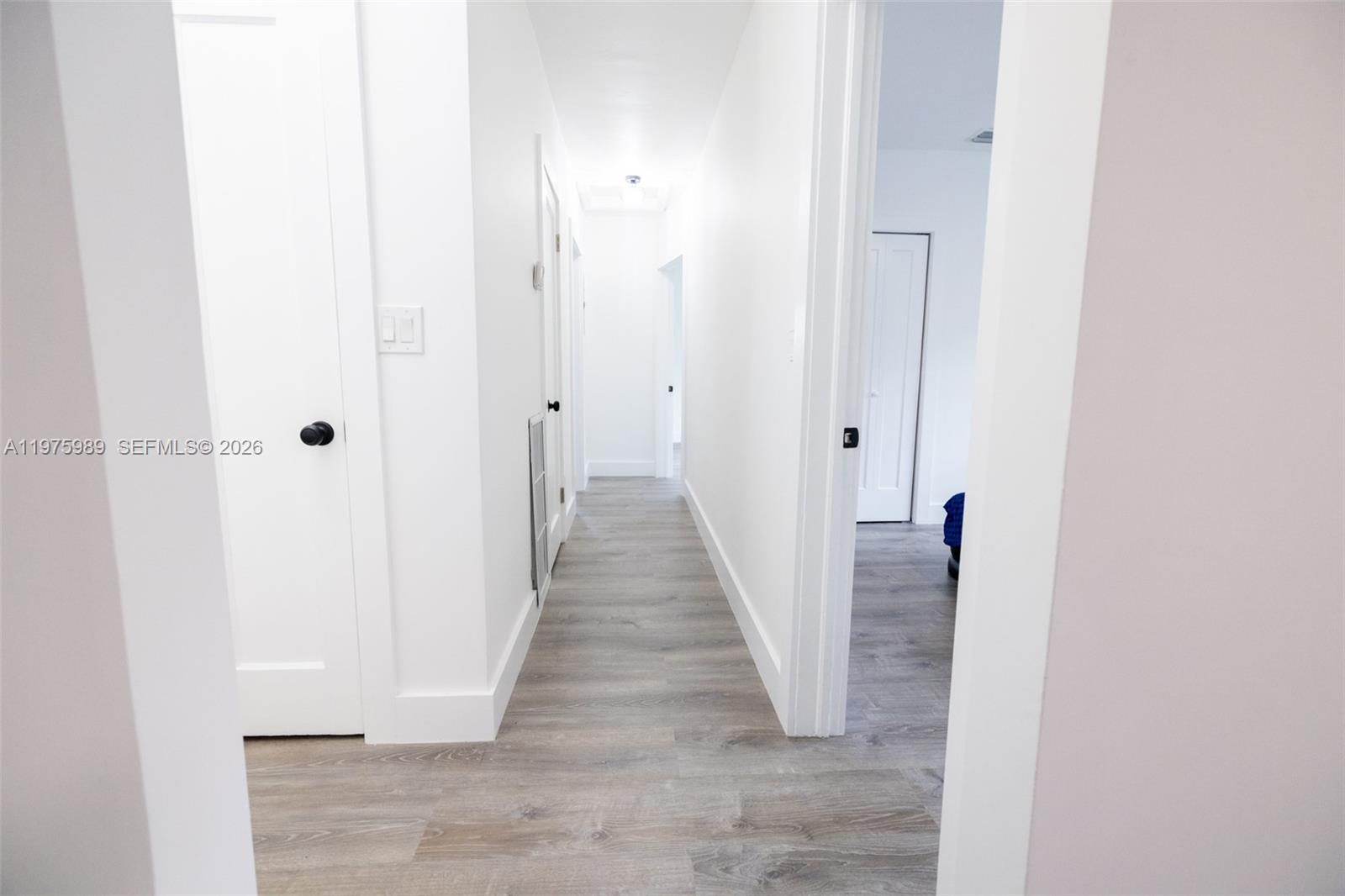 3401 Southwest 17th Street, Unit 3401 Miami, FL 33145 - Photo 66 of 69 a view of a hallway with wooden floor and staircase
