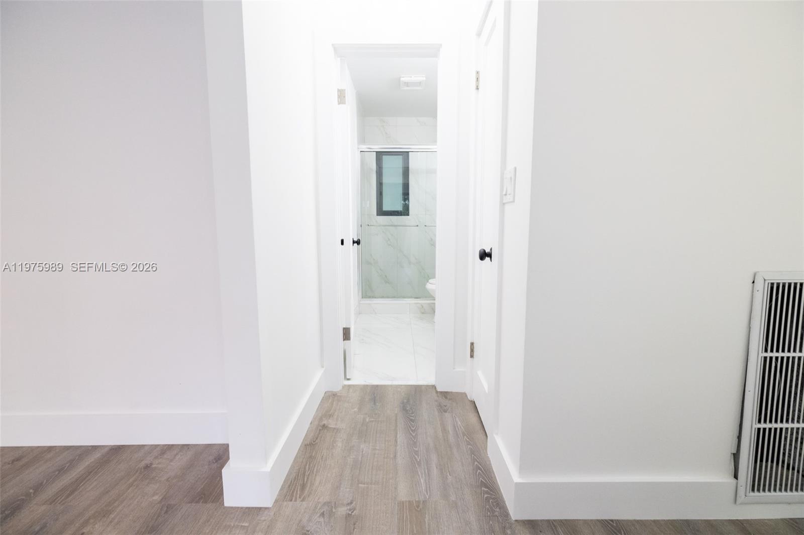 3401 Southwest 17th Street, Unit 3401 Miami, FL 33145 - Photo 67 of 69 a view of a hallway with wooden floor