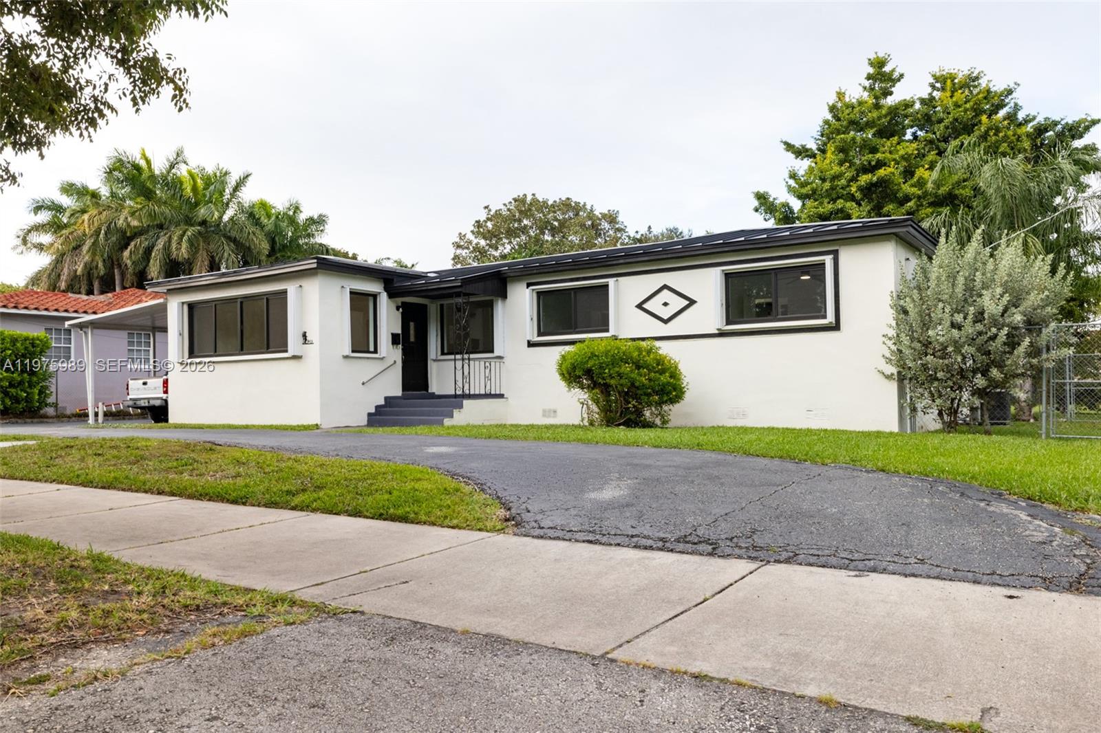 3401 Southwest 17th Street, Unit 3401 Miami, FL 33145 - Photo 9 of 69 a front view of a house with garden