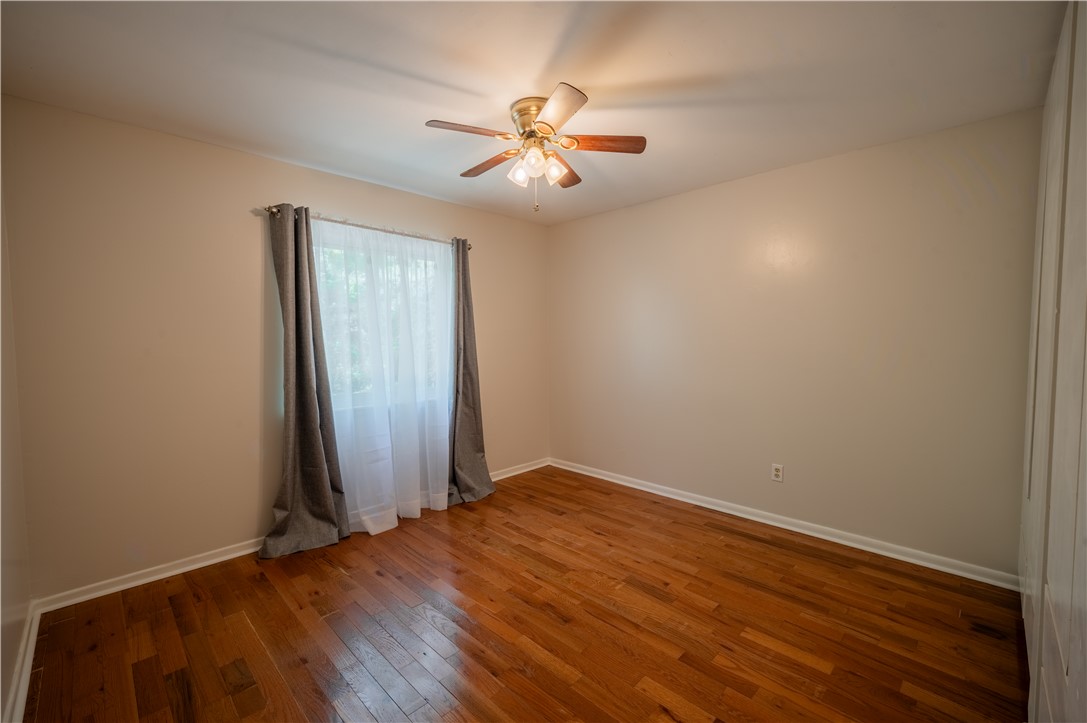150 Ligon Street, Unit 2302 Clemson, SC 29631 - Photo 10 of 18 This spacious bedroom features warm hardwood floors, an abundance of natural light, and a refreshing ceiling fan.