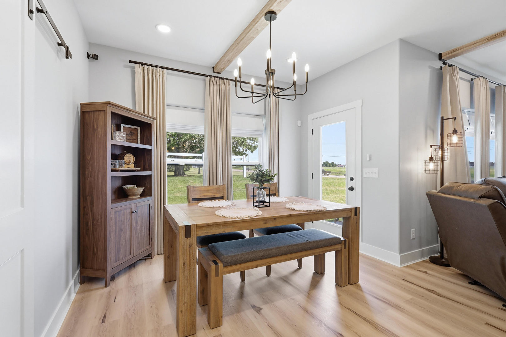 6779 Genesis Way Bettendorf, IA 52722 - Photo 17 of 36 a view of a dining room with furniture window and wooden floor