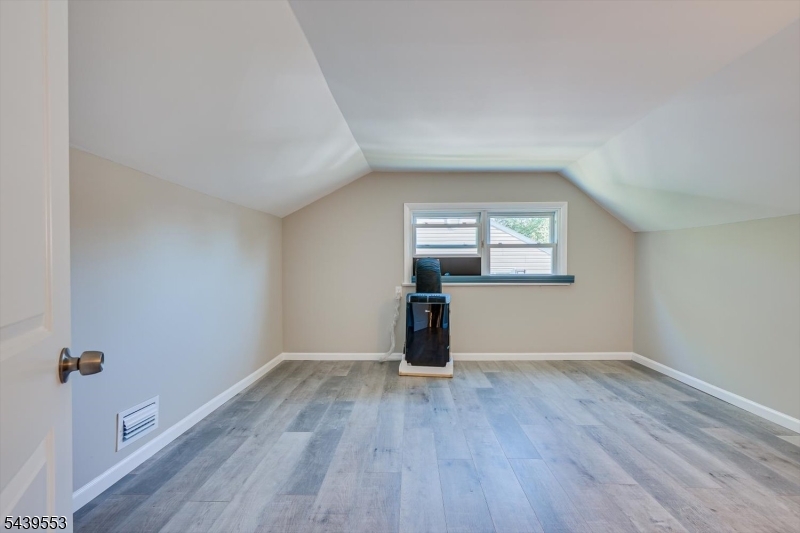15 Woodmere Street Raritan, NJ 08869 - Photo 10 of 16 wooden floor in an empty room with a window