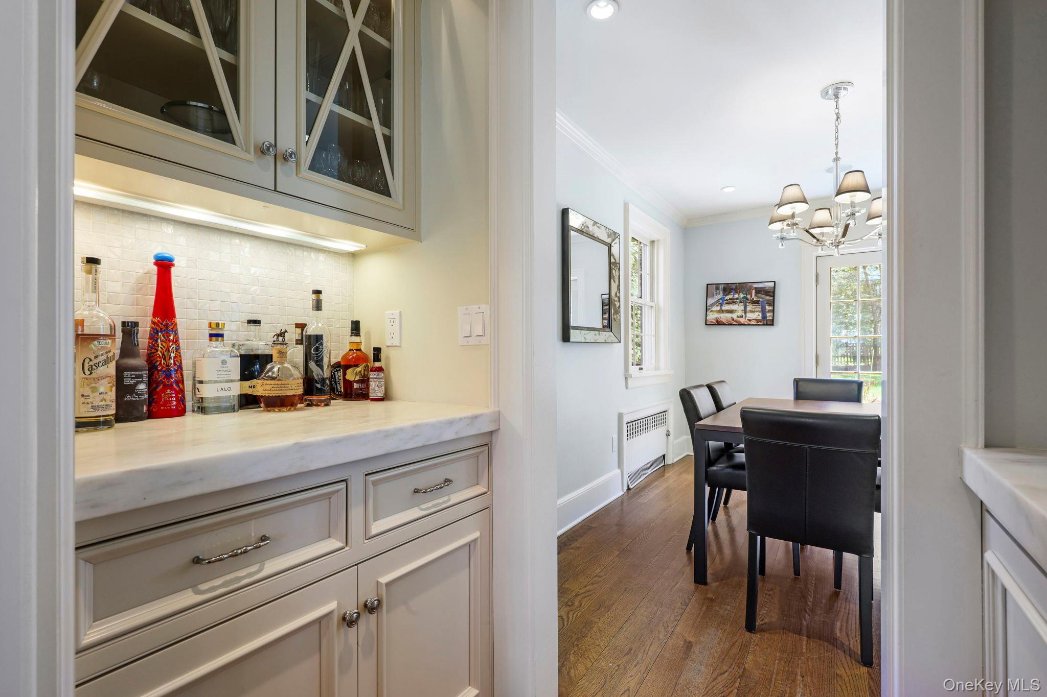 134 Brewster Road Scarsdale, NY 10583 - Photo 15 of 37 a view of a dining area with furniture and chandelier