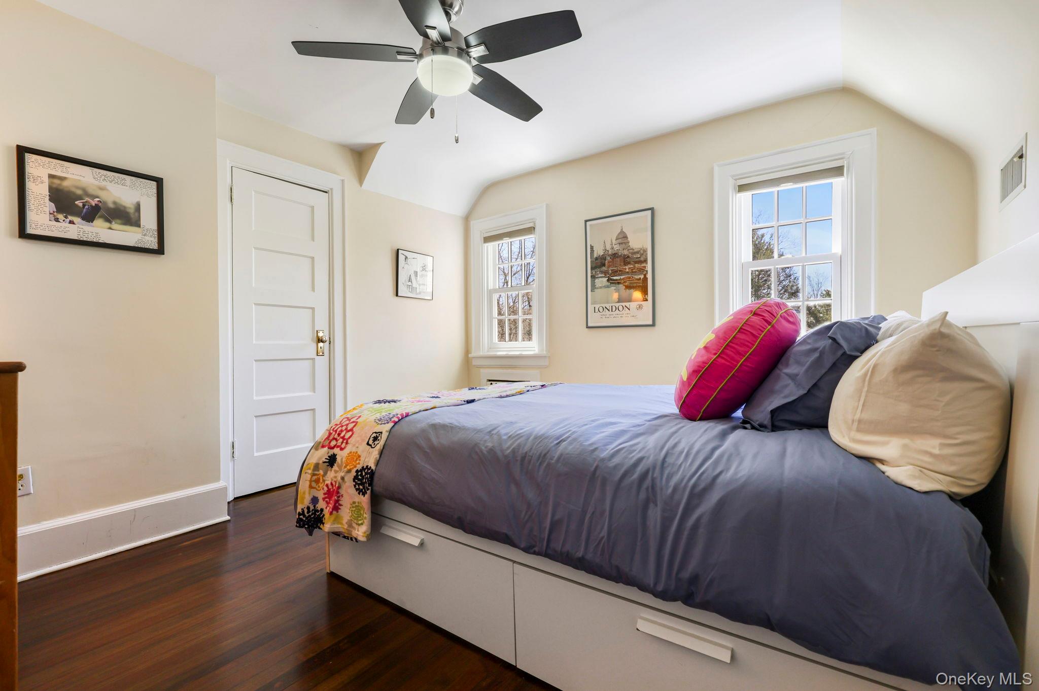 134 Brewster Road Scarsdale, NY 10583 - Photo 23 of 37 a bedroom with a bed and wooden floor