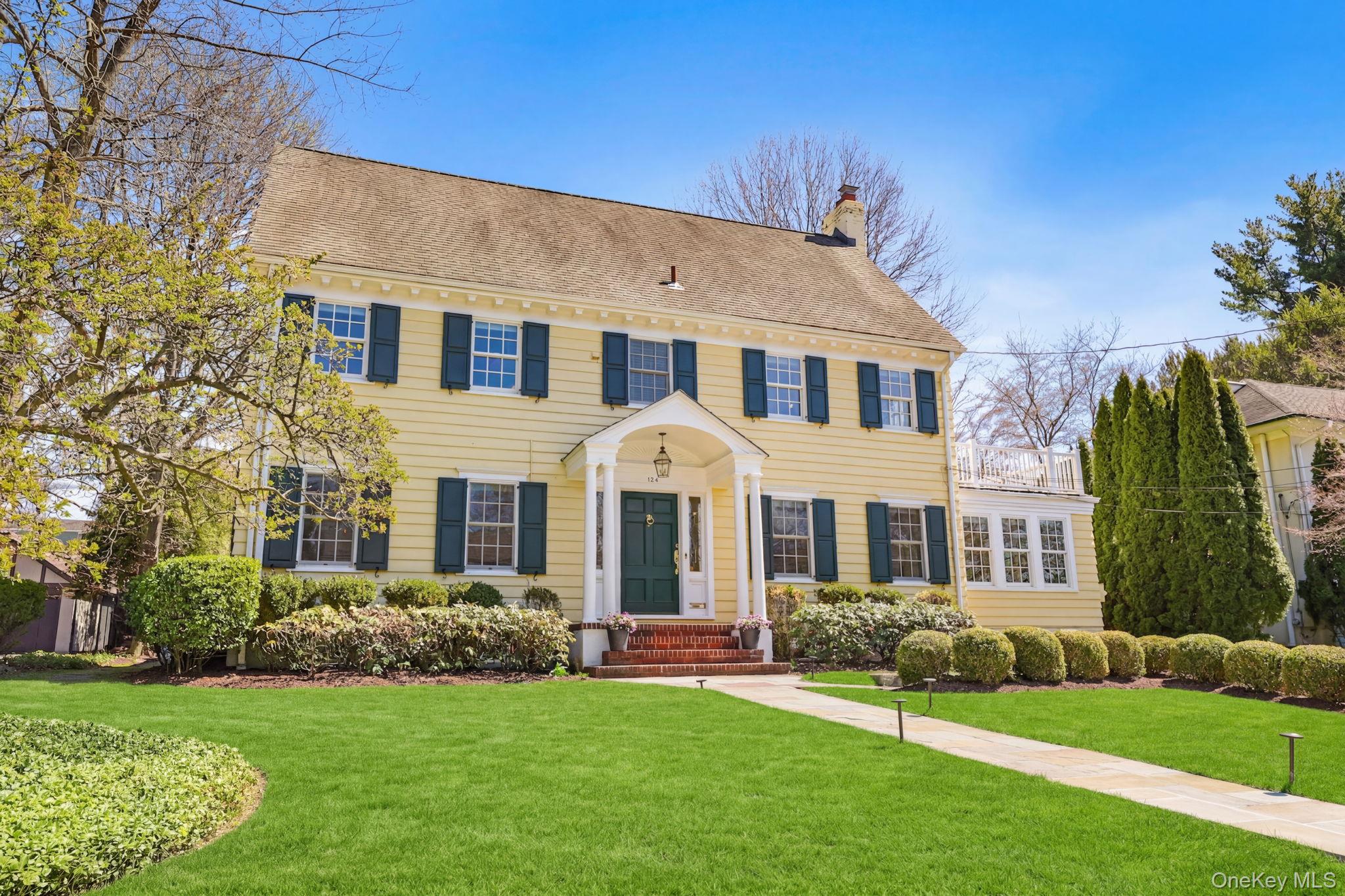 134 Brewster Road Scarsdale, NY 10583 - Photo 33 of 37 front view of a house with a yard