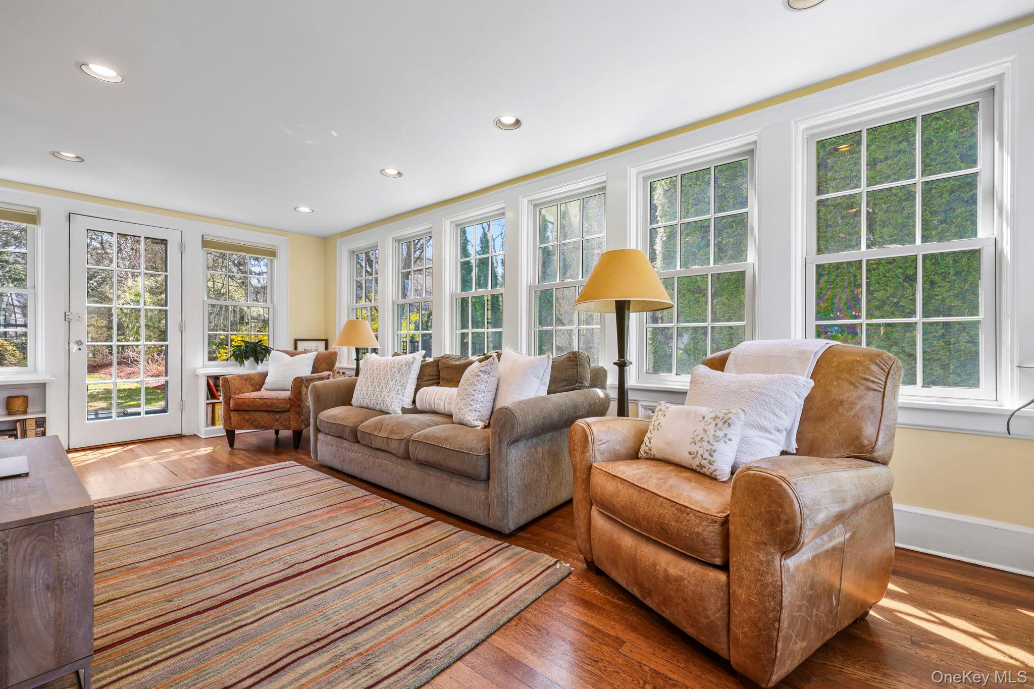 134 Brewster Road Scarsdale, NY 10583 - Photo 9 of 37 a living room with furniture and a large window