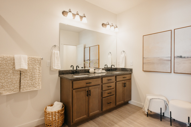 4595 North Fallow Way, Unit 511 Eagle Mountain, UT 84005 - Photo 26 of 32 Bathroom featuring double vanity and light wood finished floors