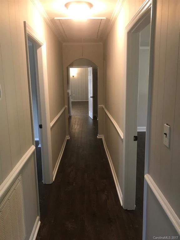 6561 Morehead Road Harrisburg, NC 28075 - Photo 16 of 24 a view of a hallway with wooden floor