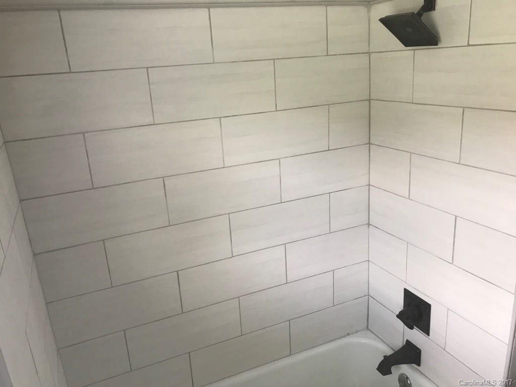 6561 Morehead Road Harrisburg, NC 28075 - Photo 21 of 24 a bathroom with a shower