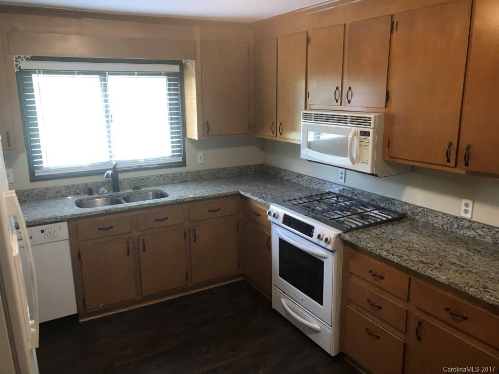 6561 Morehead Road Harrisburg, NC 28075 - Photo 8 of 24 a kitchen with appliances cabinets and a sink