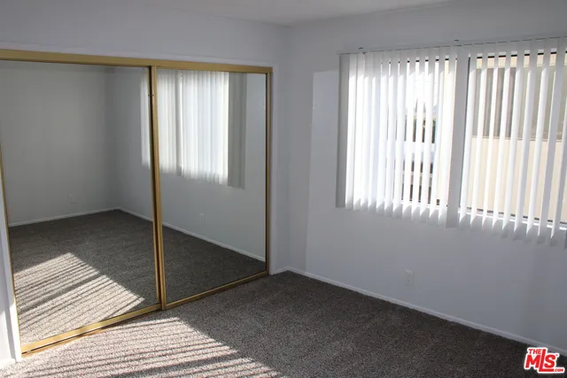 a view of a room that has a window in it