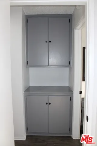 a kitchen with a sink a stove and refrigerator