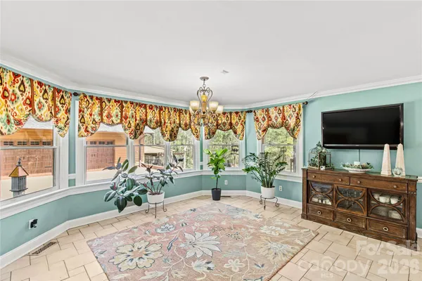 a kitchen with stainless steel appliances granite countertop a stove a washer and dryer