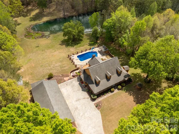 a view of a swimming pool with a patio