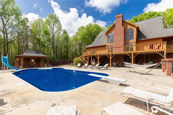 a view of a swimming pool with a lounge chair