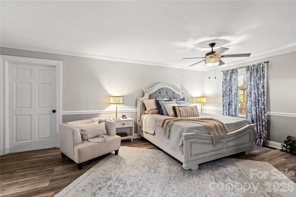 a spacious bedroom with a bed and window