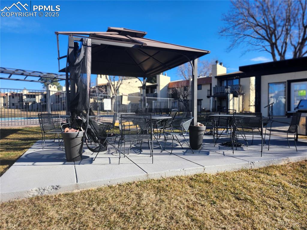 1038 Fontmore Road, Unit D Colorado Springs, CO 80904 - Photo 26 of 27 a view of a chairs and table in the patio