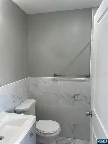 a bathroom with a toilet and a sink