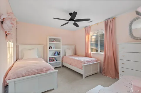 a bedroom with a bed and a mirror