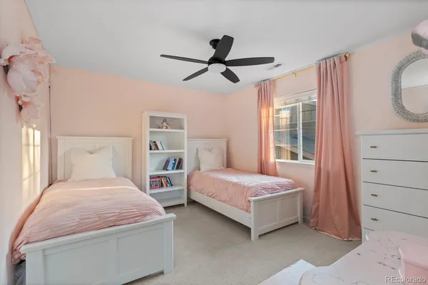 a bedroom with a bed and a mirror