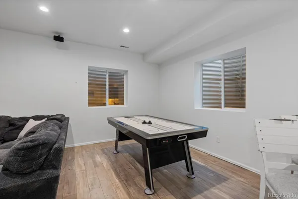 a view of a workspace with furniture and window